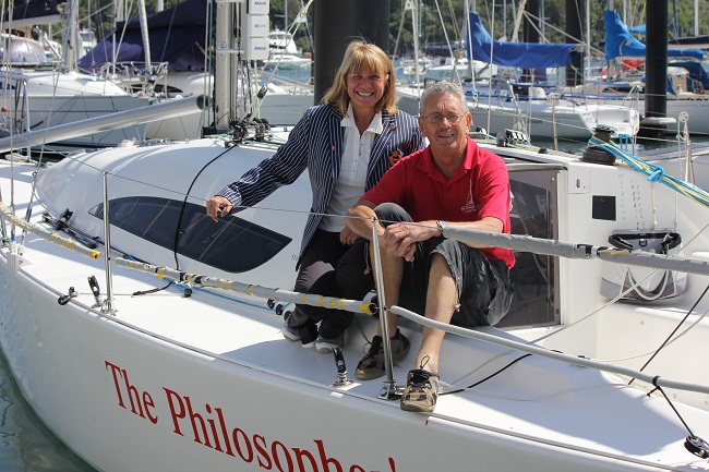 Commodore Julie Hodder and Peter Sorensen aboard his The Philosopher